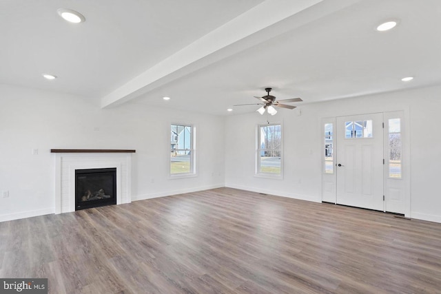 1011 Southwood Dr, Shippensburg, PA 17257 - unfurnished living room with wood finished floors, recessed lighting, baseboards, ceiling fan, and a glass covered fireplace