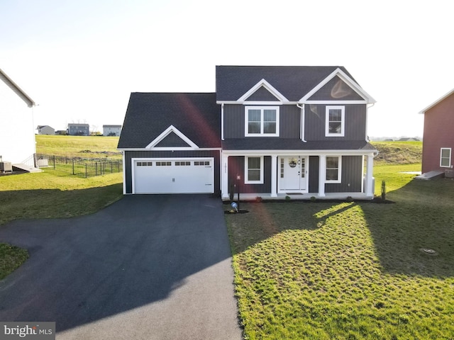 1011 Southwood Dr, Shippensburg, PA 17257 - traditional-style home featuring driveway, a garage, covered porch, and central air condition unit