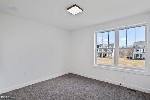1011 Southwood Dr, Shippensburg, PA 17257 - unfurnished room with dark colored carpet, baseboards, and a smoke detector