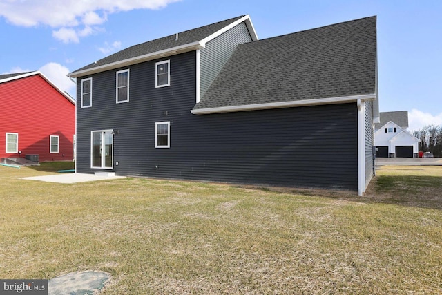 1011 Southwood Dr, Shippensburg, PA 17257 - back of house featuring a shingled roof, a yard, and a patio