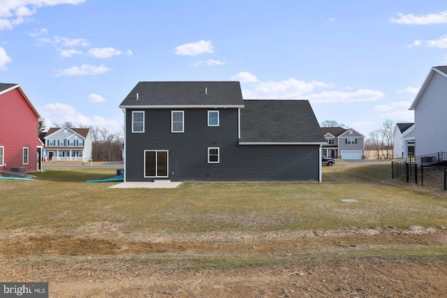 1011 Southwood Dr, Shippensburg, PA 17257 - rear view of house featuring a patio, roof with shingles, and a yard