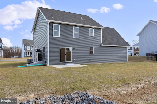 1011 Southwood Dr, Shippensburg, PA 17257 - rear view of house with central air condition unit, a patio area, and a lawn