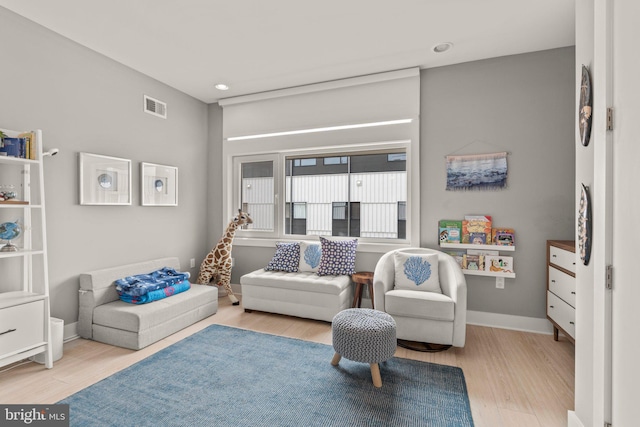 sitting room featuring visible vents, recessed lighting, baseboards, and wood finished floors