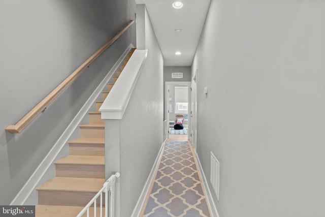 stairs featuring baseboards, recessed lighting, and visible vents