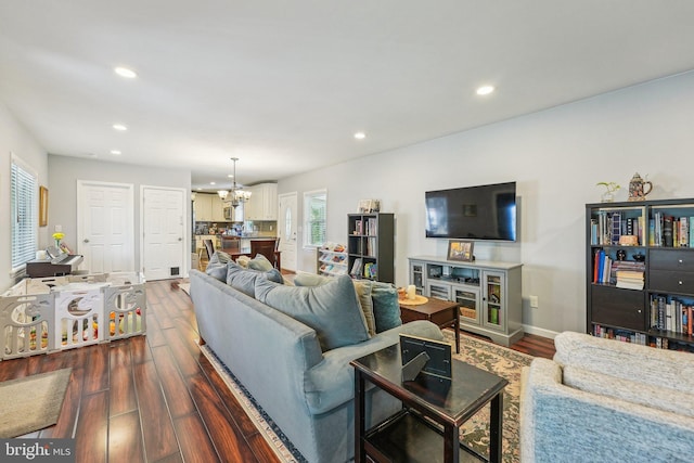 562 Washington Ave, Ewing, NJ 08628 - living room with dark wood-type flooring, a chandelier, recessed lighting, and baseboards