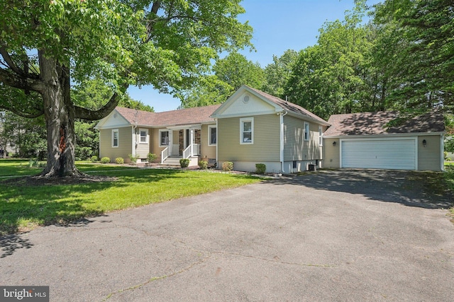 562 Washington Ave, Ewing, NJ 08628 - single story home with an outbuilding, a detached garage, and a front lawn
