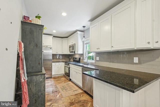 562 Washington Ave, Ewing, NJ 08628 - kitchen with stainless steel appliances, light marble finish flooring, a sink, recessed lighting, and decorative backsplash