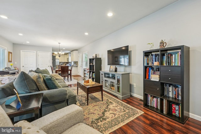 562 Washington Ave, Ewing, NJ 08628 - living room with a chandelier, dark wood-style floors, recessed lighting, plenty of natural light, and baseboards