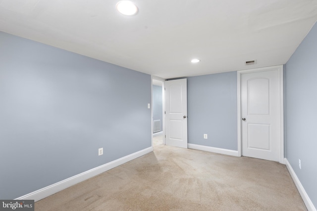 interior space featuring baseboards, recessed lighting, and visible vents