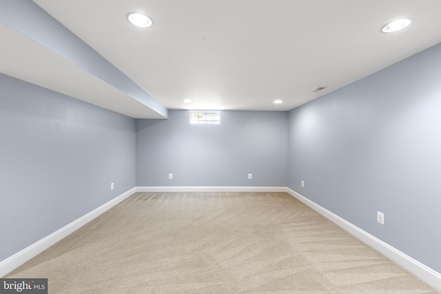 below grade area featuring recessed lighting, baseboards, visible vents, and carpet