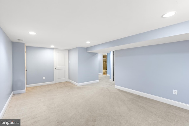 finished basement featuring recessed lighting, baseboards, and carpet