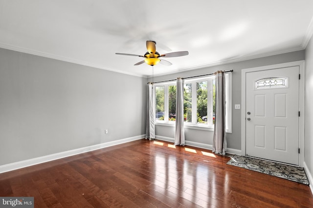 foyer entrance with baseboards, ceiling fan, ornamental molding, and hardwood / wood-style flooring