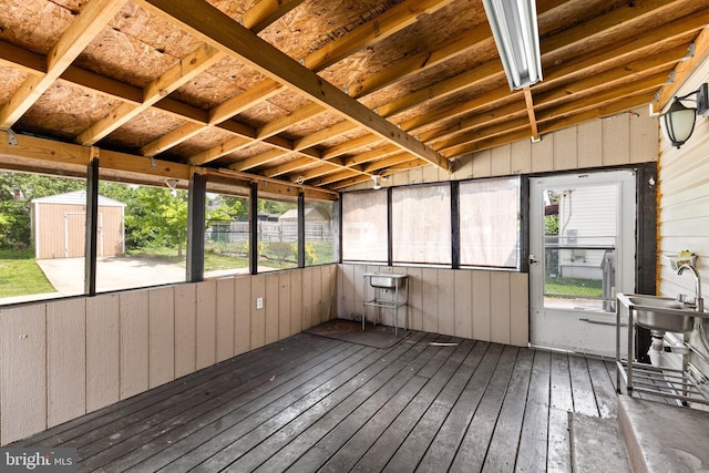 unfurnished sunroom with a wealth of natural light