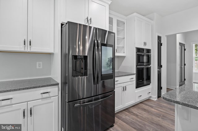 14875 Buckingham Ct, Issue, MD 20645 - kitchen featuring stainless steel refrigerator with ice dispenser, white cabinets, glass insert cabinets, dark stone counters, and dark wood-type flooring