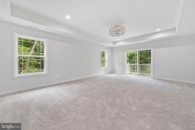 14875 Buckingham Ct, Issue, MD 20645 - empty room with a tray ceiling, baseboards, carpet flooring, and recessed lighting