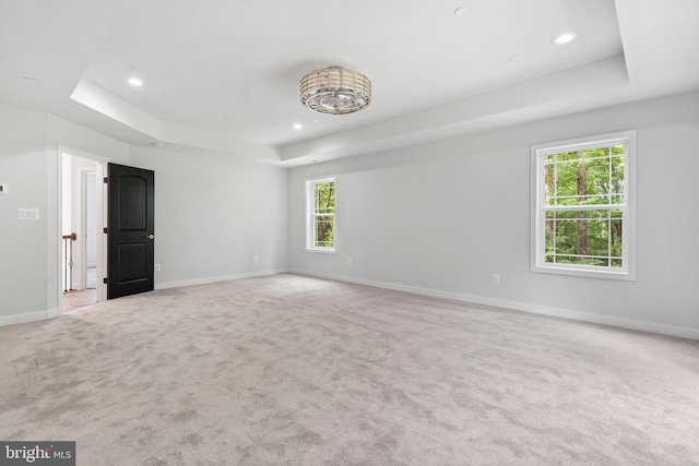 14875 Buckingham Ct, Issue, MD 20645 - unfurnished room featuring a raised ceiling, baseboards, light carpet, and recessed lighting