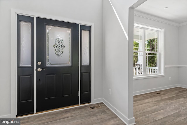 14875 Buckingham Ct, Issue, MD 20645 - foyer entrance with wood finished floors, ornamental molding, and baseboards