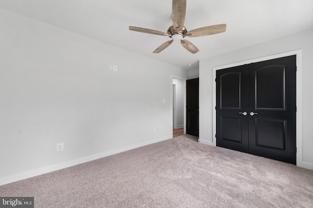 14875 Buckingham Ct, Issue, MD 20645 - unfurnished bedroom featuring carpet floors, a closet, baseboards, and ceiling fan
