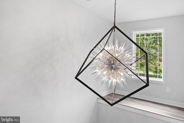 14875 Buckingham Ct, Issue, MD 20645 - detailed view of a chandelier and baseboards