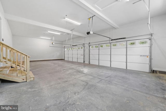14875 Buckingham Ct, Issue, MD 20645 - garage with a garage door opener and baseboards