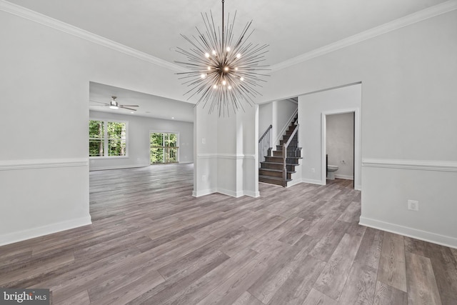 14875 Buckingham Ct, Issue, MD 20645 - unfurnished living room featuring stairs, a chandelier, crown molding, wood finished floors, and baseboards