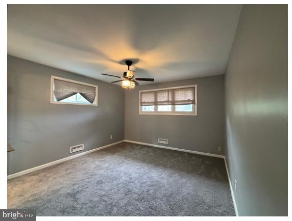 7204 Croydon Rd, Baltimore, MD 21207 - carpeted empty room featuring plenty of natural light, ceiling fan, and baseboards