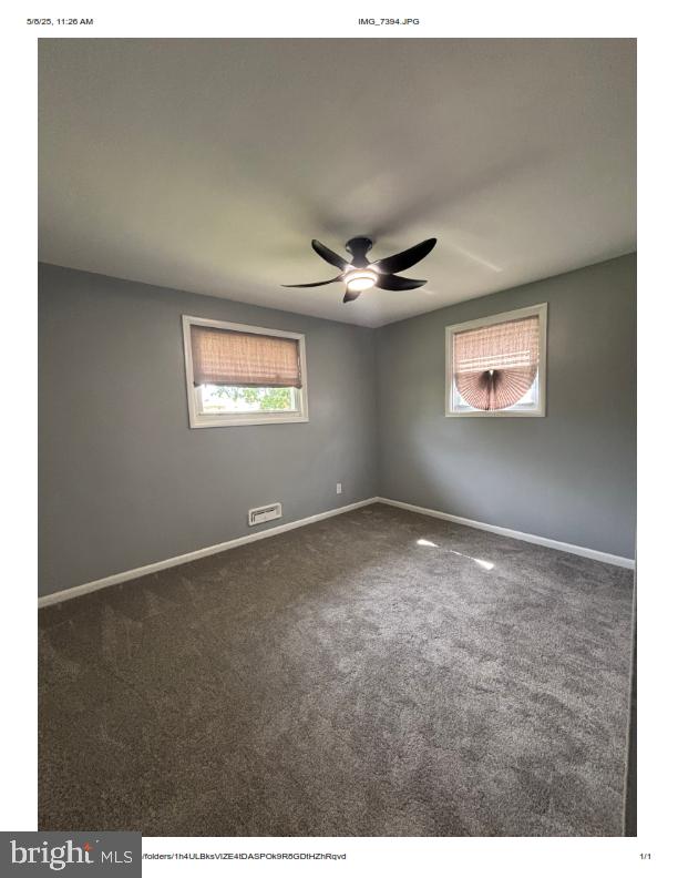 7204 Croydon Rd, Baltimore, MD 21207 - spare room with healthy amount of natural light, a ceiling fan, baseboards, and carpet floors