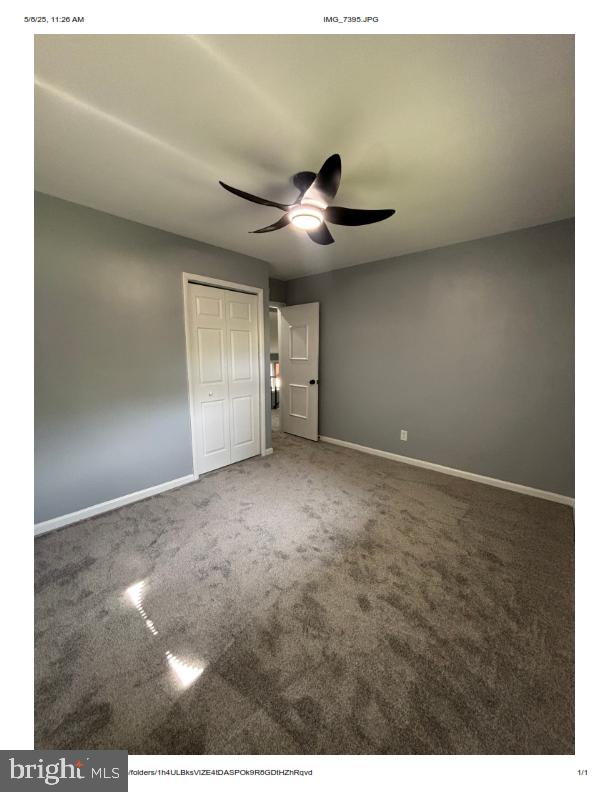 7204 Croydon Rd, Baltimore, MD 21207 - unfurnished bedroom featuring carpet, baseboards, a closet, and a ceiling fan