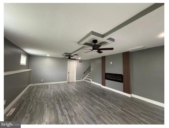 7204 Croydon Rd, Baltimore, MD 21207 - unfurnished living room with a ceiling fan, stairway, wood finished floors, and baseboards
