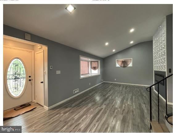 7204 Croydon Rd, Baltimore, MD 21207 - foyer entrance featuring wood finished floors, lofted ceiling, baseboards, and recessed lighting