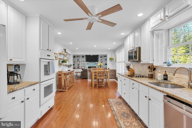 107 Forest Ave, Medford, NJ 08055 - kitchen with a sink, white cabinets, a healthy amount of sunlight, and appliances with stainless steel finishes