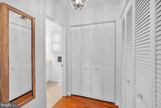 107 Forest Ave, Medford, NJ 08055 - hall with light wood-type flooring and a notable chandelier