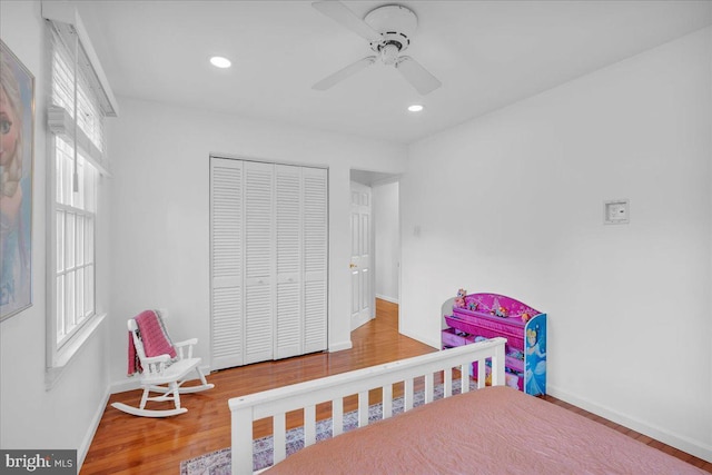 107 Forest Ave, Medford, NJ 08055 - bedroom featuring multiple windows, a closet, wood finished floors, and baseboards