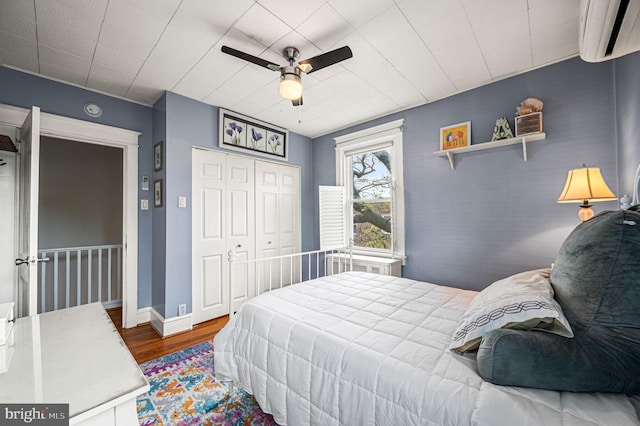 4037 Mitchell St, Philadelphia, PA 19128 - bedroom with ceiling fan, a wall mounted air conditioner, wood finished floors, baseboards, and a closet