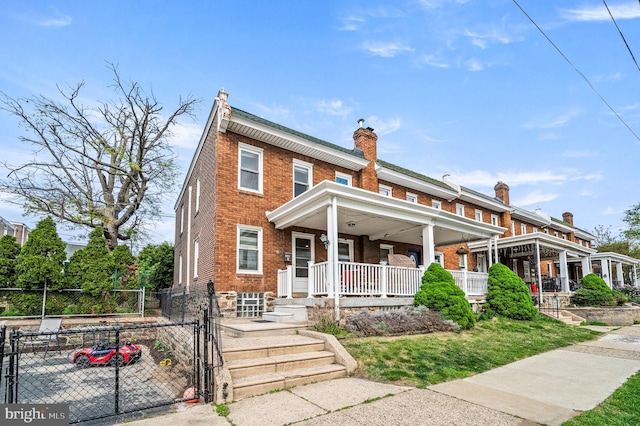 4037 Mitchell St, Philadelphia, PA 19128 - view of front of house featuring fence, a chimney, brick siding, a gate, and a porch