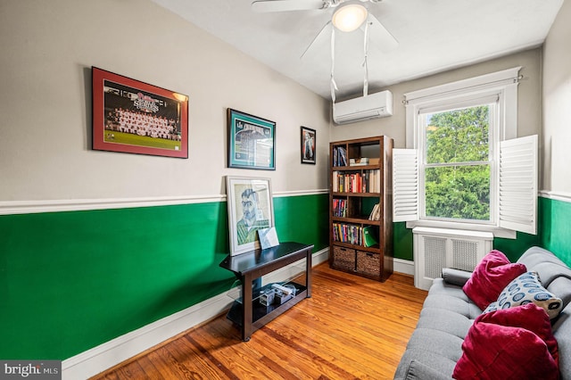 4037 Mitchell St, Philadelphia, PA 19128 - sitting room with ceiling fan, radiator, baseboards, wood finished floors, and a wall mounted AC