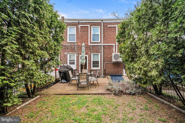 4037 Mitchell St, Philadelphia, PA 19128 - rear view of property with outdoor dining area, ac unit, a deck, and brick siding