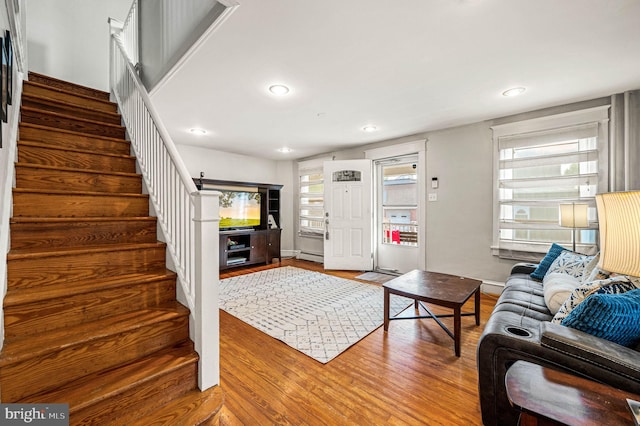 4037 Mitchell St, Philadelphia, PA 19128 - living room featuring wood finished floors, baseboards, stairway, recessed lighting, and a baseboard radiator