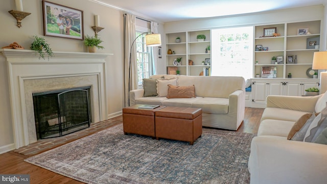 30 Woods Ln, Hanover, PA 17331 - living room with wood finished floors, a fireplace, and baseboards