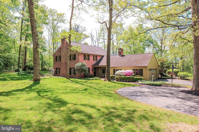 30 Woods Ln, Hanover, PA 17331 - view of front of house featuring a chimney, driveway, and a front lawn