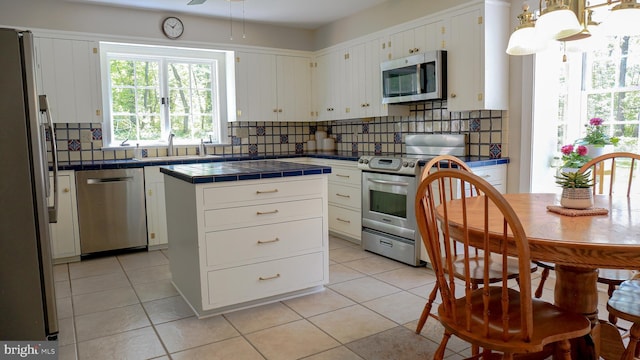 30 Woods Ln, Hanover, PA 17331 - kitchen featuring stainless steel appliances, a sink, tile countertops, tasteful backsplash, and white cabinetry