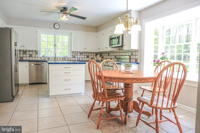 30 Woods Ln, Hanover, PA 17331 - dining space with plenty of natural light, ceiling fan, light tile patterned flooring, and a chandelier