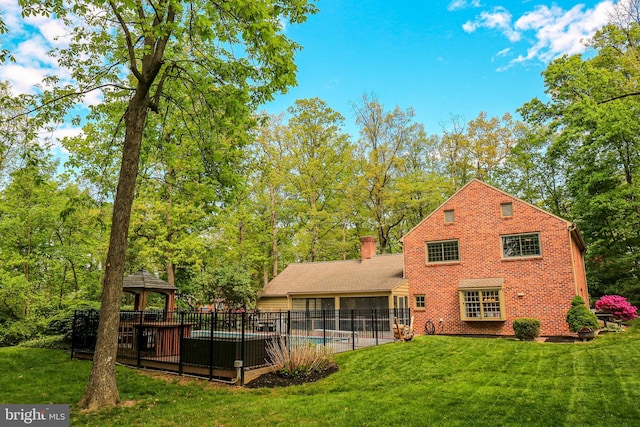 30 Woods Ln, Hanover, PA 17331 - rear view of house with a gazebo, a chimney, and brick siding
