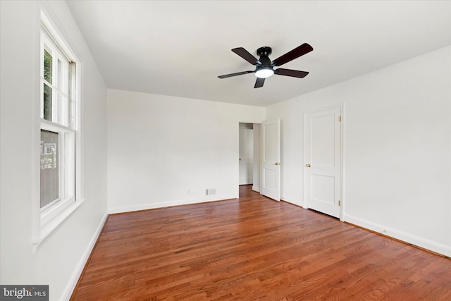 705 Stewart Ave, Glen Burnie, MD 21061 - unfurnished bedroom with wood finished floors, baseboards, and ceiling fan