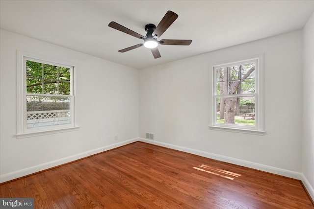705 Stewart Ave, Glen Burnie, MD 21061 - unfurnished room with healthy amount of natural light, baseboards, and wood finished floors