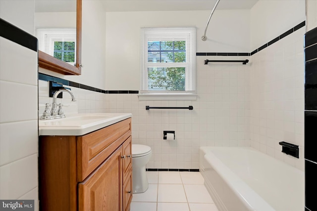 705 Stewart Ave, Glen Burnie, MD 21061 - bathroom with tile walls, tile patterned floors, vanity, wainscoting, and toilet