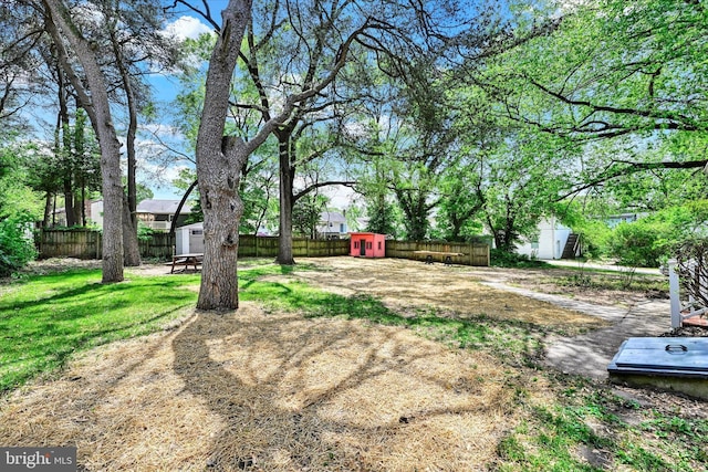 705 Stewart Ave, Glen Burnie, MD 21061 - fenced backyard featuring a storage unit and an outdoor structure