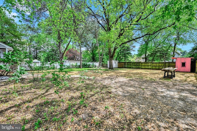 705 Stewart Ave, Glen Burnie, MD 21061 - fenced backyard with a storage shed and an outdoor structure