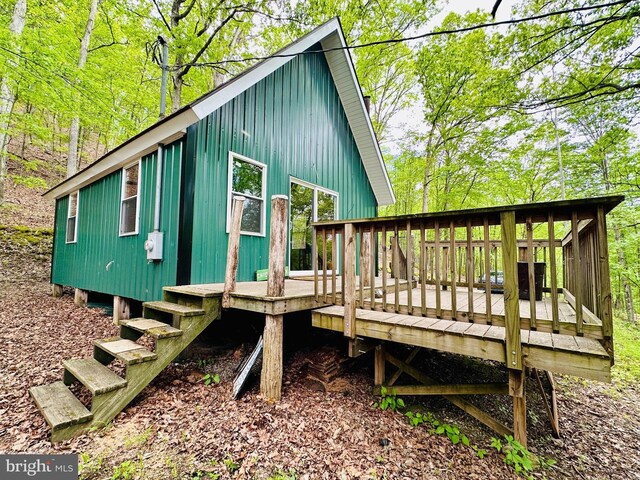 back of property featuring a deck