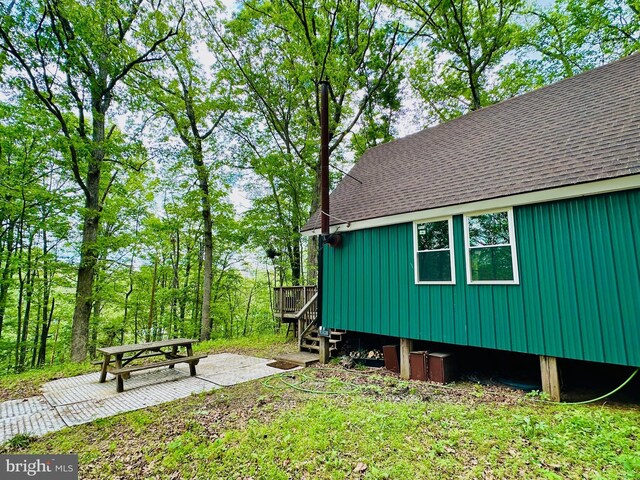 view of yard featuring a deck and a patio area